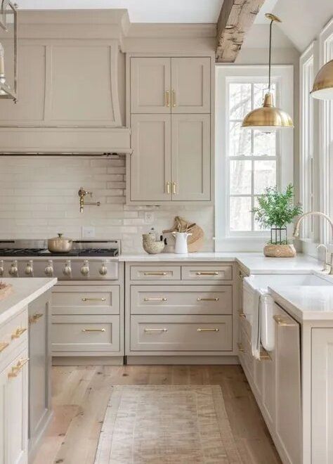 neutral shaker kitchen cabinet ideas with beige cabinets and brass hardware accents