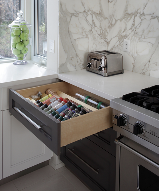 An open drawer with a spice organizer