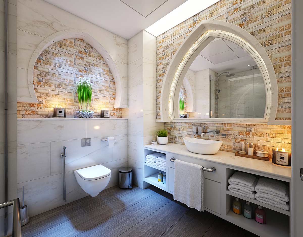 A mauve palette bathroom in an arabesque style with a single sink vanity.