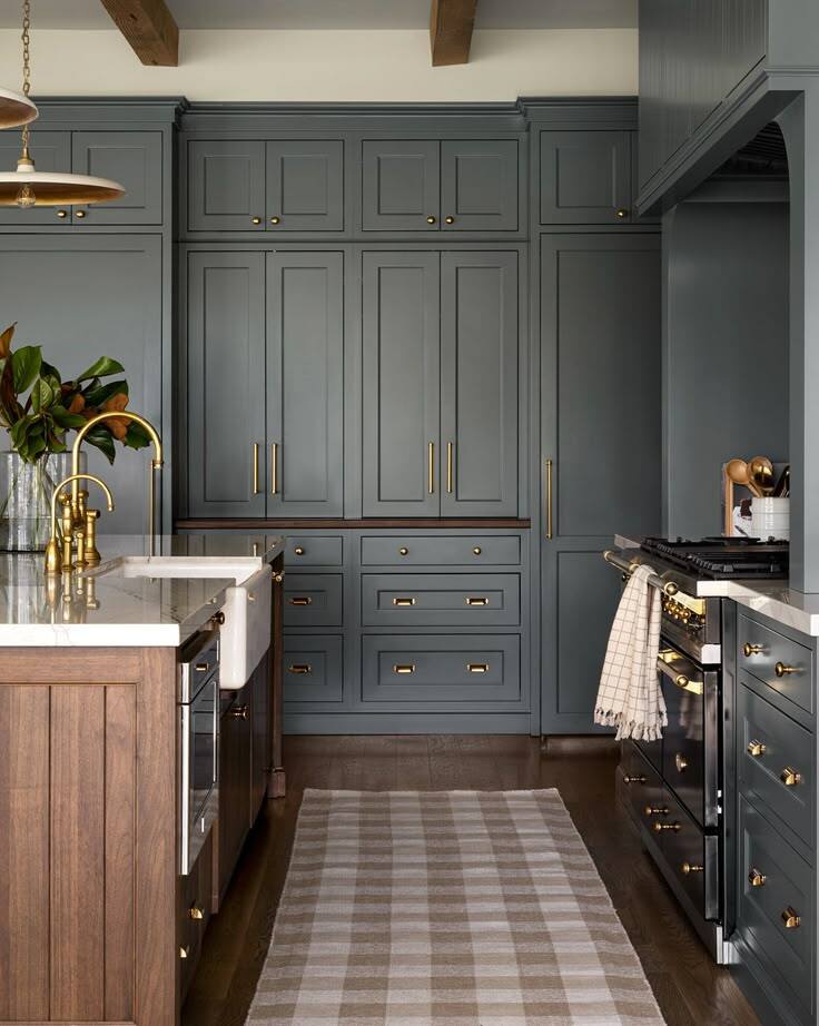 muted navy shaker kitchen cabinet ideas with brass hardware and blue gray cabinet doors