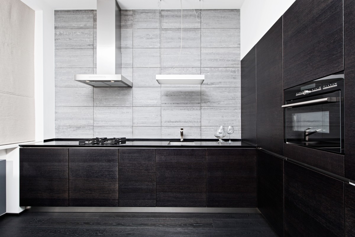 Black kitchen with slab style cabinet doors