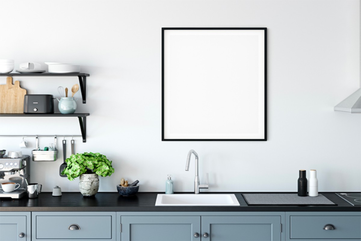 A kitchen with trendy light blue shaker cabinets.