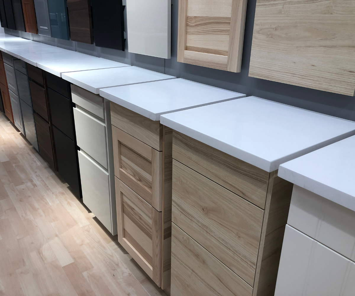 Display showcasing popular kitchen cabinet door styles, finishes, and materials including shaker, slab, wood veneer, painted, and modern cabinet door designs. Helpful for comparing cabinet door styles before a kitchen remodel or cabinet refacing project.