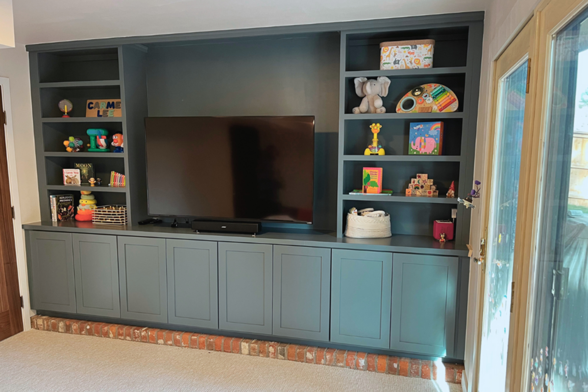 Dark Shaker Cabinet Doors for Custom Media Walls Dark shaker replacement cabinet doors in a custom built-in media wall with floating shelves and integrated television.