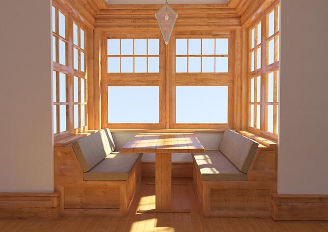 A dining booth surrounded by windows.