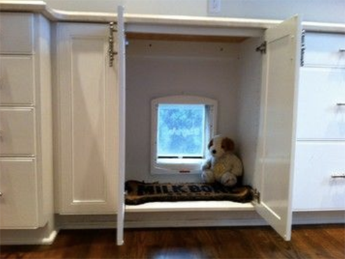 Hidden clearance dog door