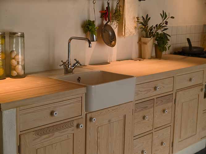 A kitchen with a mix of inset and overlay cabinets.