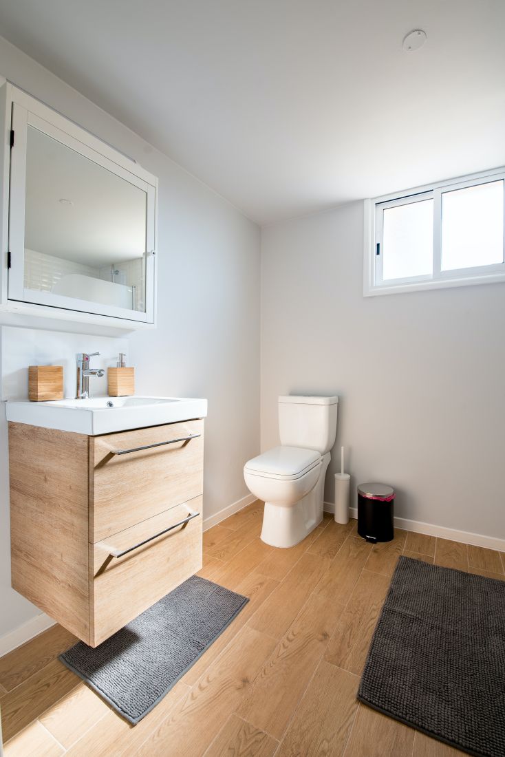 A bathroom with a floating bathroom vanity.