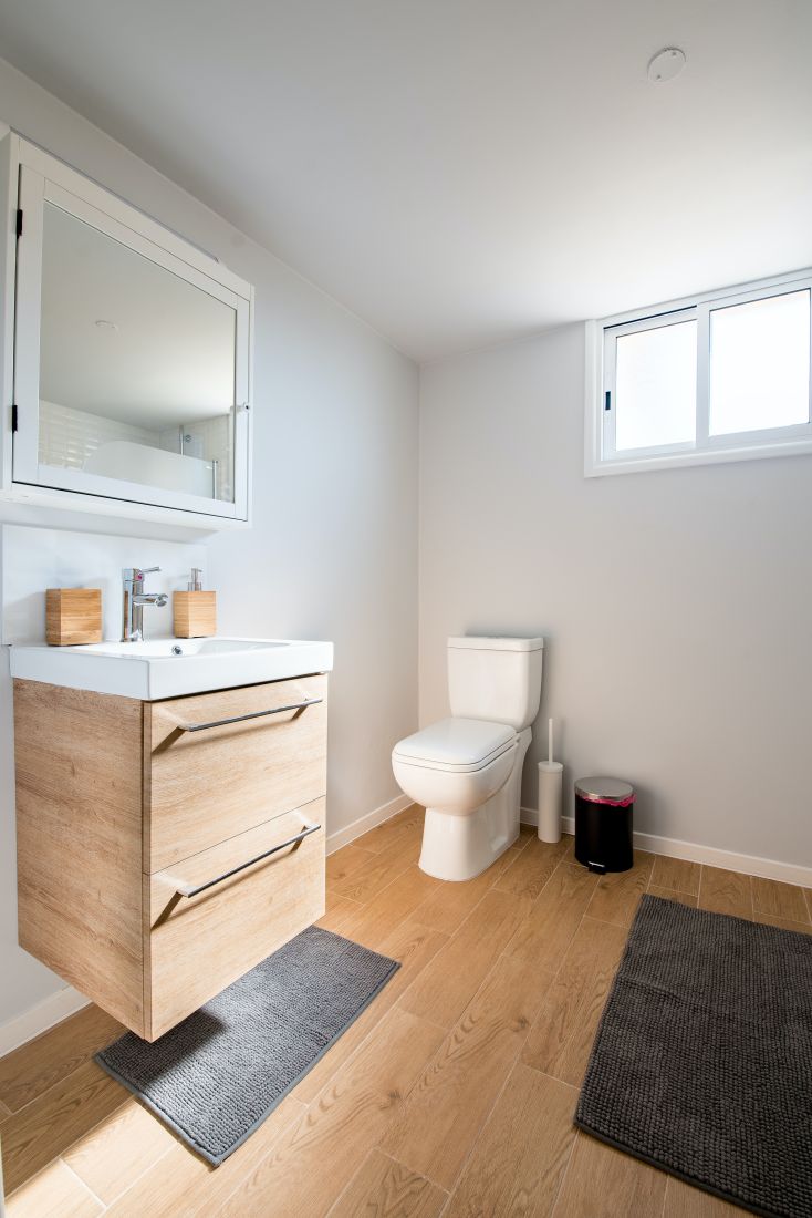 A bathroom with a floating bathroom vanity. A bathroom with a floating bathroom vanity.
