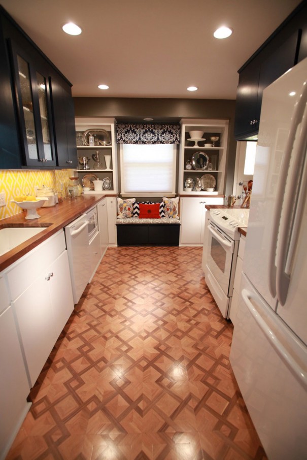 White and woodgrain kitchen with navy blue upper cabinets.