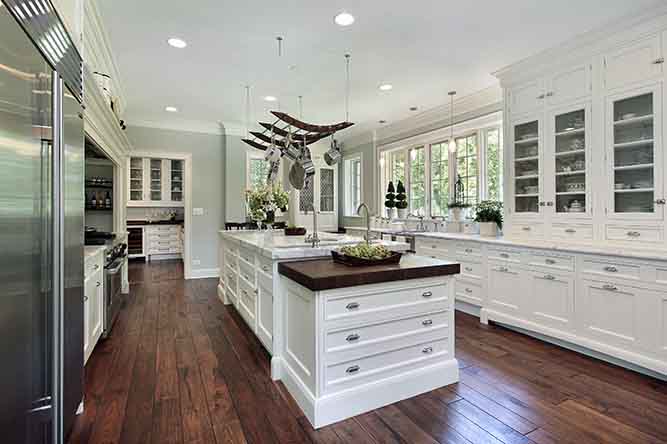 A large kitchen with lots of shaker cabinets.