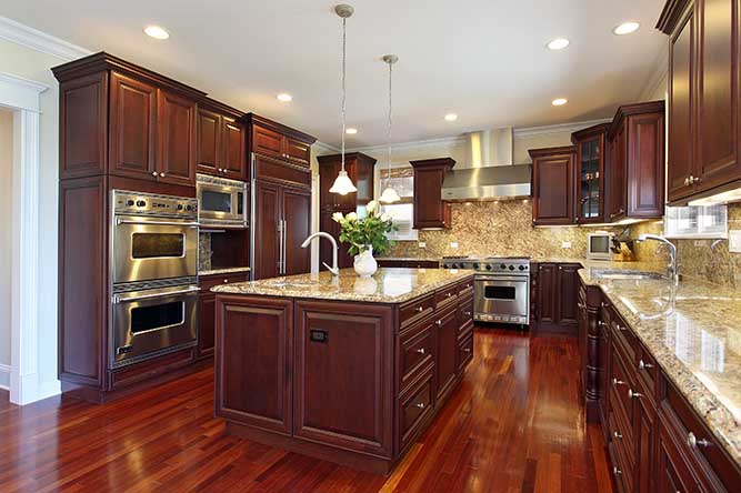 A large, traditional kitchen with dark cabinets.