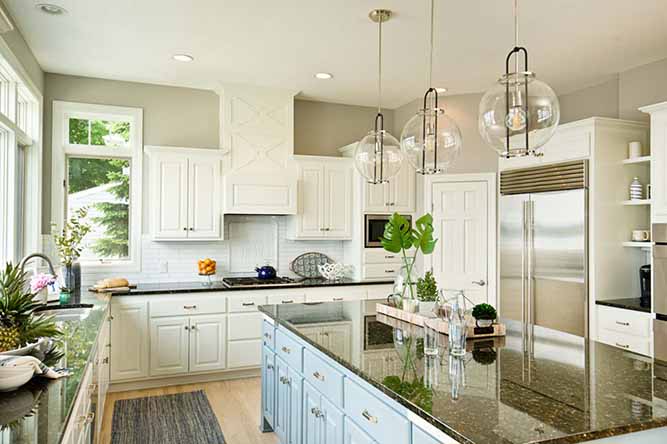 A large kitchen with revere cabinet doors.