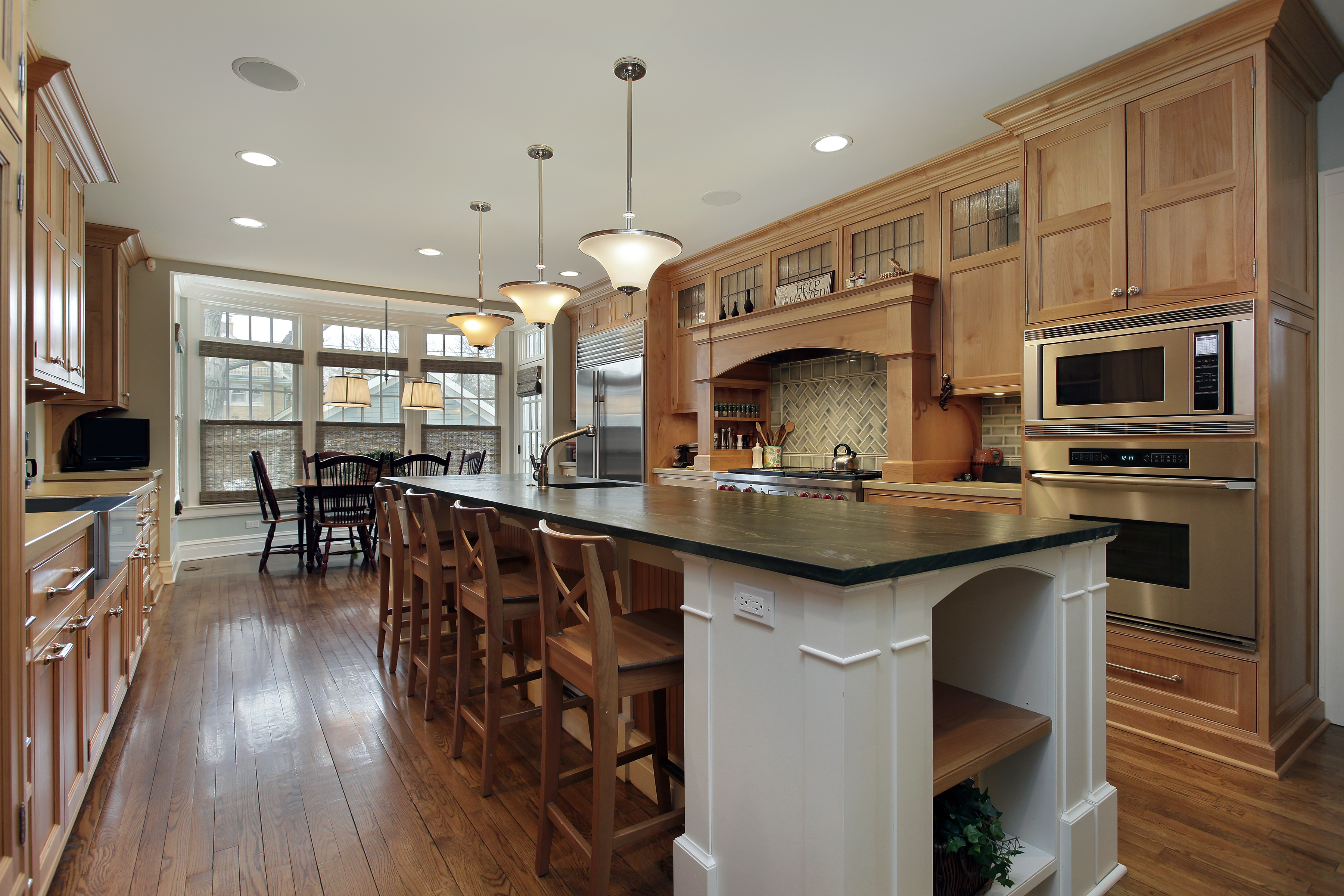 Maple Unfinished Cabinet Doors in Traditional Kitchen Design Traditional kitchen featuring Maple unfinished cabinet doors with a natural wood finish, showcasing the smooth grain pattern and durability that make Maple one of the most popular wood species for custom cabinetry.