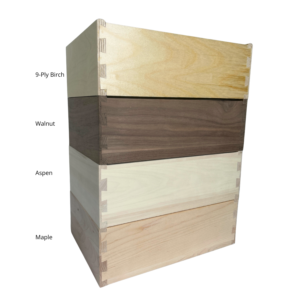 drawer box material comparison showing birch walnut aspen and maple drawer boxes with dovetail joints