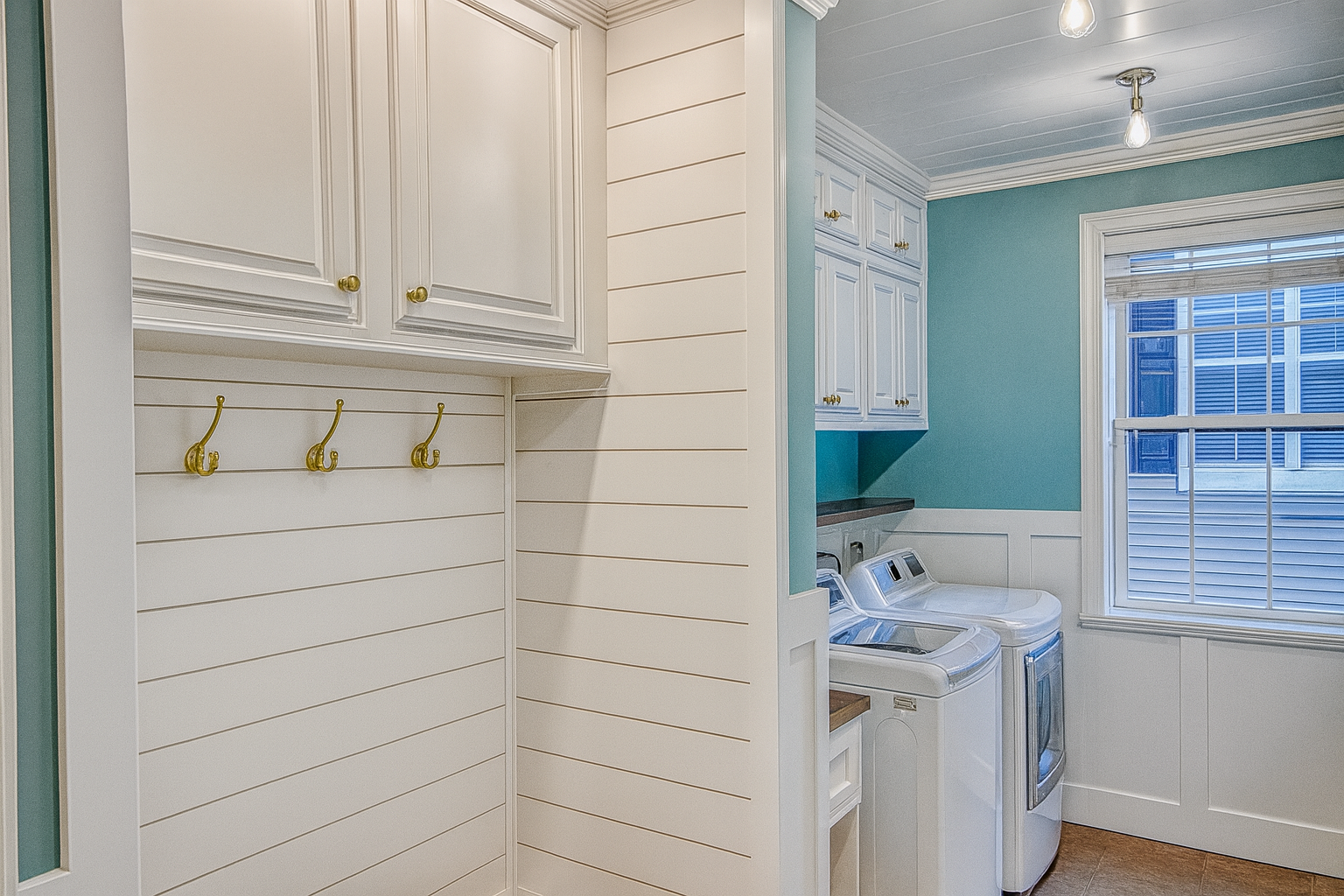 Customer laundry room closet built-ins with custom cabinets, shelving, drawers, and hanging storage