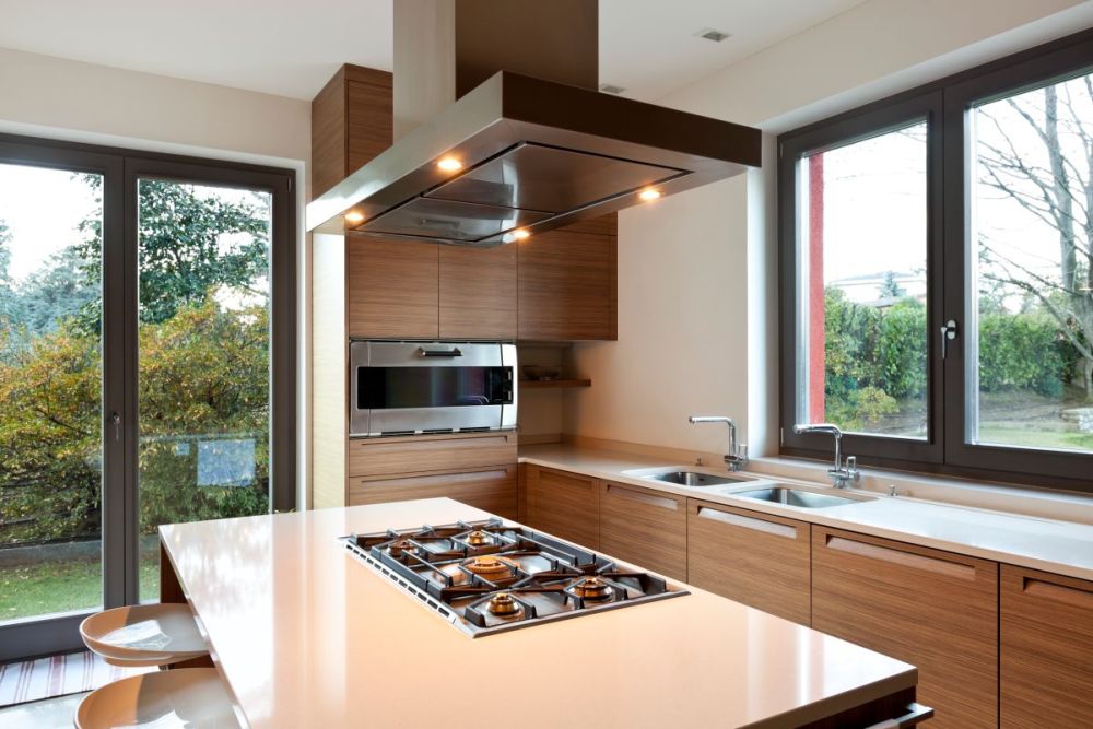 Sleek kitchen with hood over stove