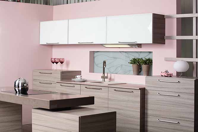 A modern kitchen with two tone kitchen cabinets.