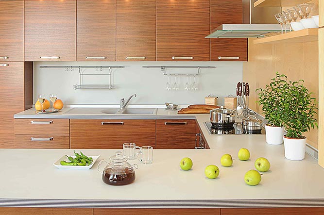 A modern, u-shaped kitchen with thermofoil cabinets.