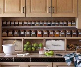 Open shelving for storing spice above the countertop.