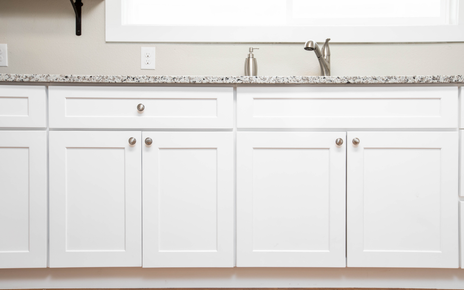 Painted White MDF Shaker Cabinet Doors White painted shaker cabinet doors installed in a residential kitchen.