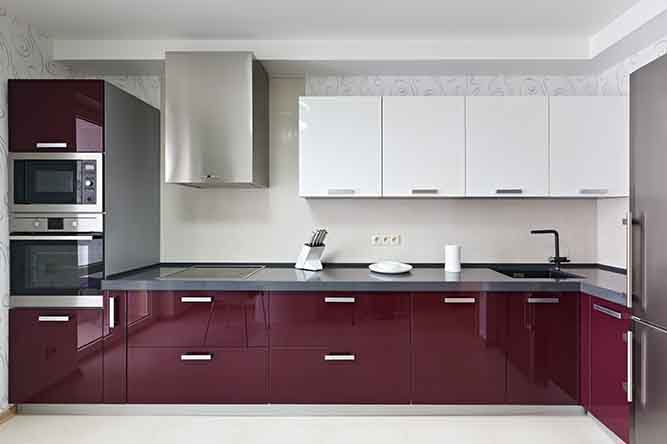 A red and white thermofoil kitchen.