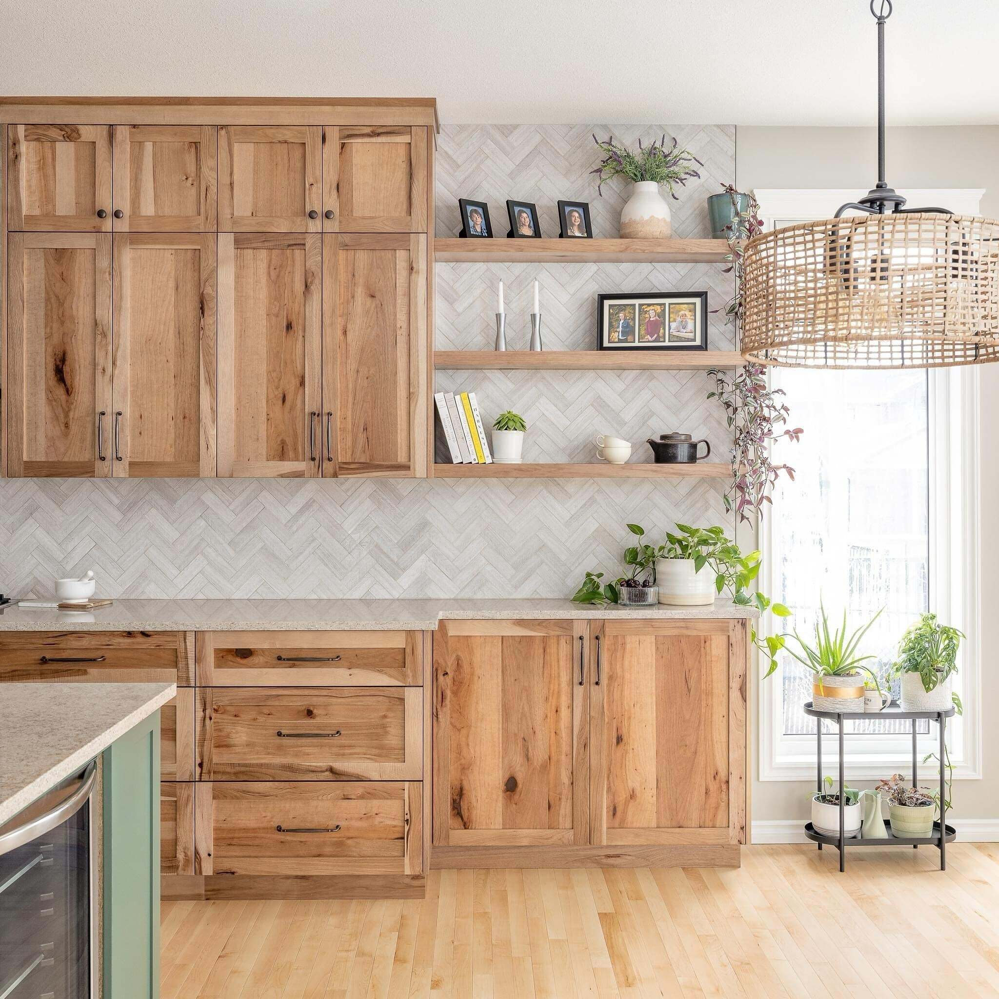 Rustic Hickory Kitchen Cabinets with Open Shelving Rustic hickory kitchen cabinets with floating wood shelves, a herringbone tile backsplash, and natural wood finishes.