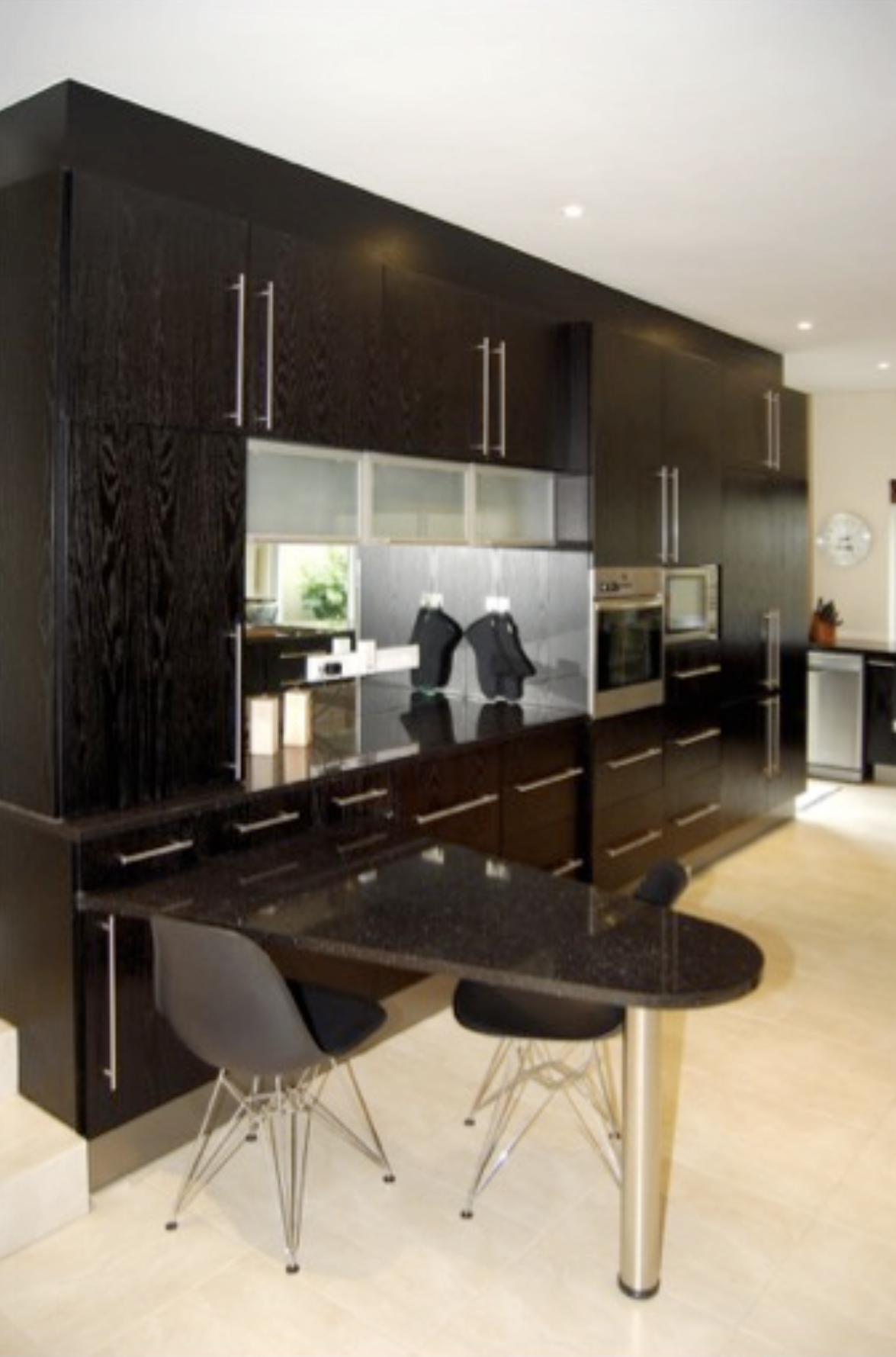A black stained collection of cabinets.