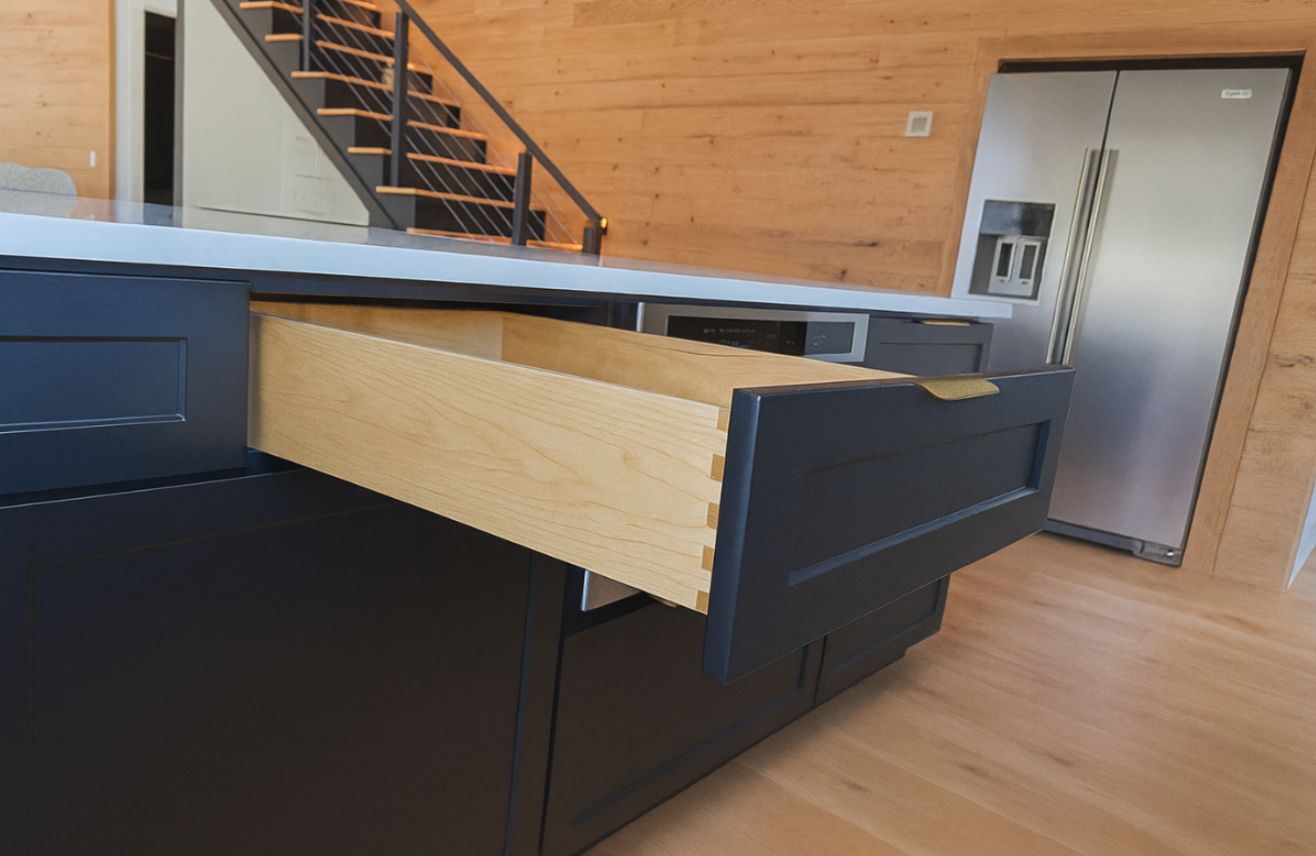Baltic birch drawer box installed on drawer slides inside cabinet showing proper fit and alignment