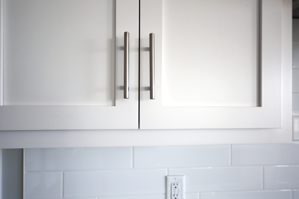 Up-close white shaker cabinet doors