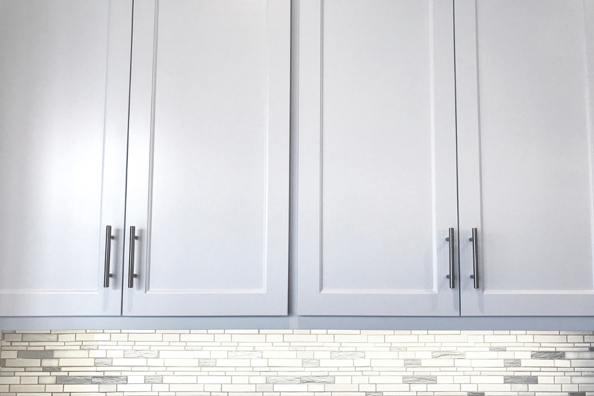 Beveled shaker cabinet doors with angled inner edge in a white finish