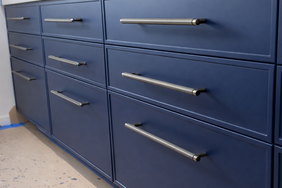 Slim shaker cabinet doors with narrow rails and stiles in a modern navy finish