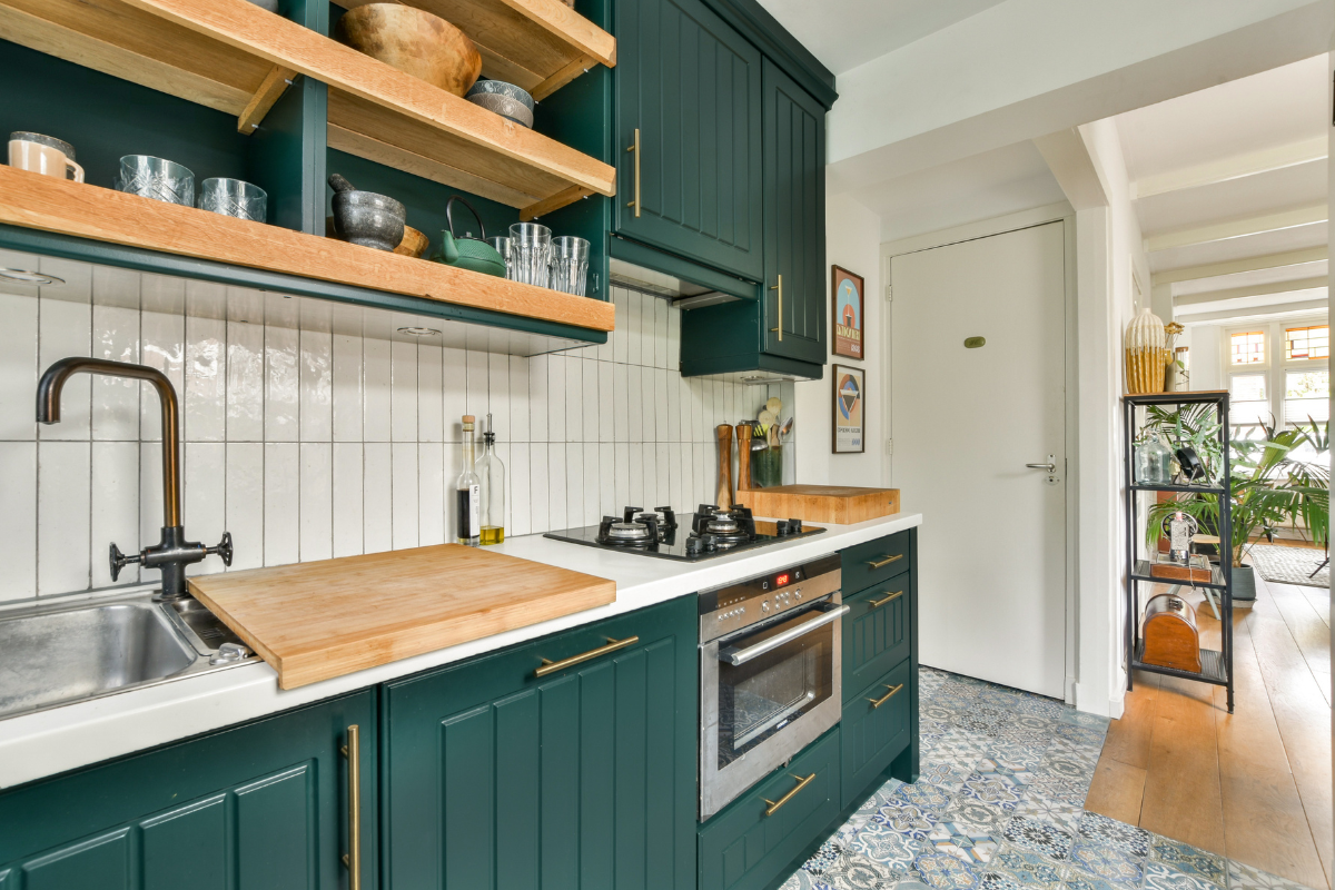 Beaded and stepped shaker cabinet door styles in a modern green kitchen design