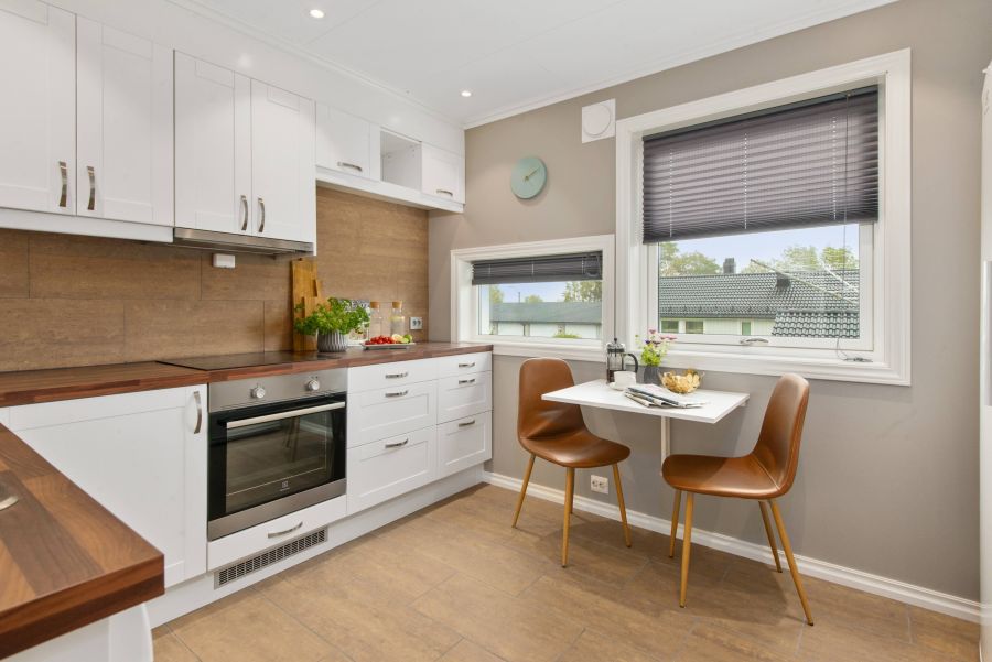 A small kitchen with L-shaped cabinets.