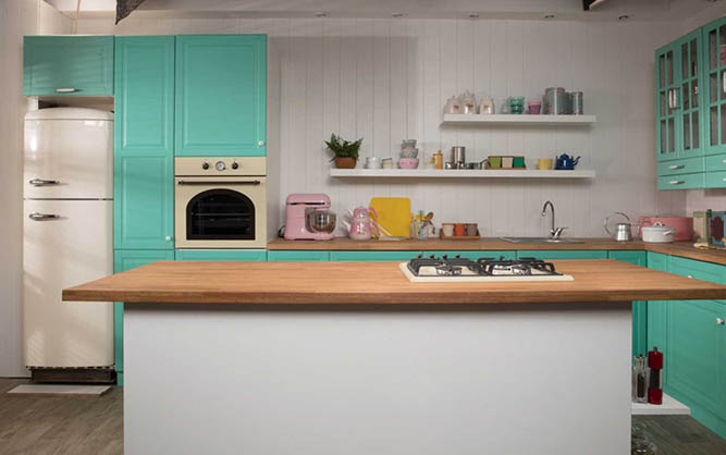 A teal kitchen with retro appliances and open shelving.