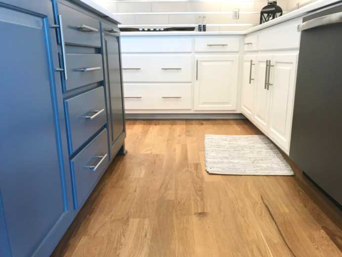 Two tone kitchen with blue and white revere cabinet doors.