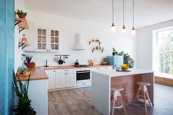 A large, open kitchen with white cabinets.